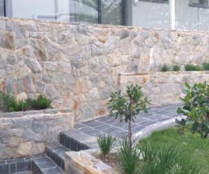 Natural stone design retaining walls outside home